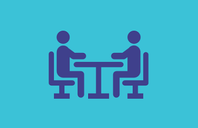 Dark blue figures icon on a teal background, symbolizing stakeholder engagement or individuals involved in discussions.