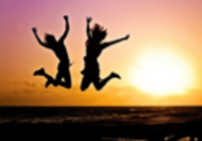 Kids jumping at sunset