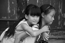 Bringing Families Home Program Black and white photo of sisters