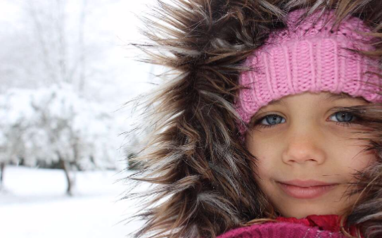 How to Become a Foster Parent Close up of little girl with a snow background